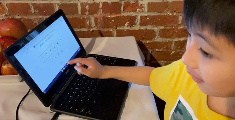 Anna Perng’s 7-year-old son Ethan, who has autism, works on a school-issued Chromebook at their home in Philadelphia. Because of his disability, Perng said the kindergartener was unable to complete the activity. (Photo courtesy Anna Perng)